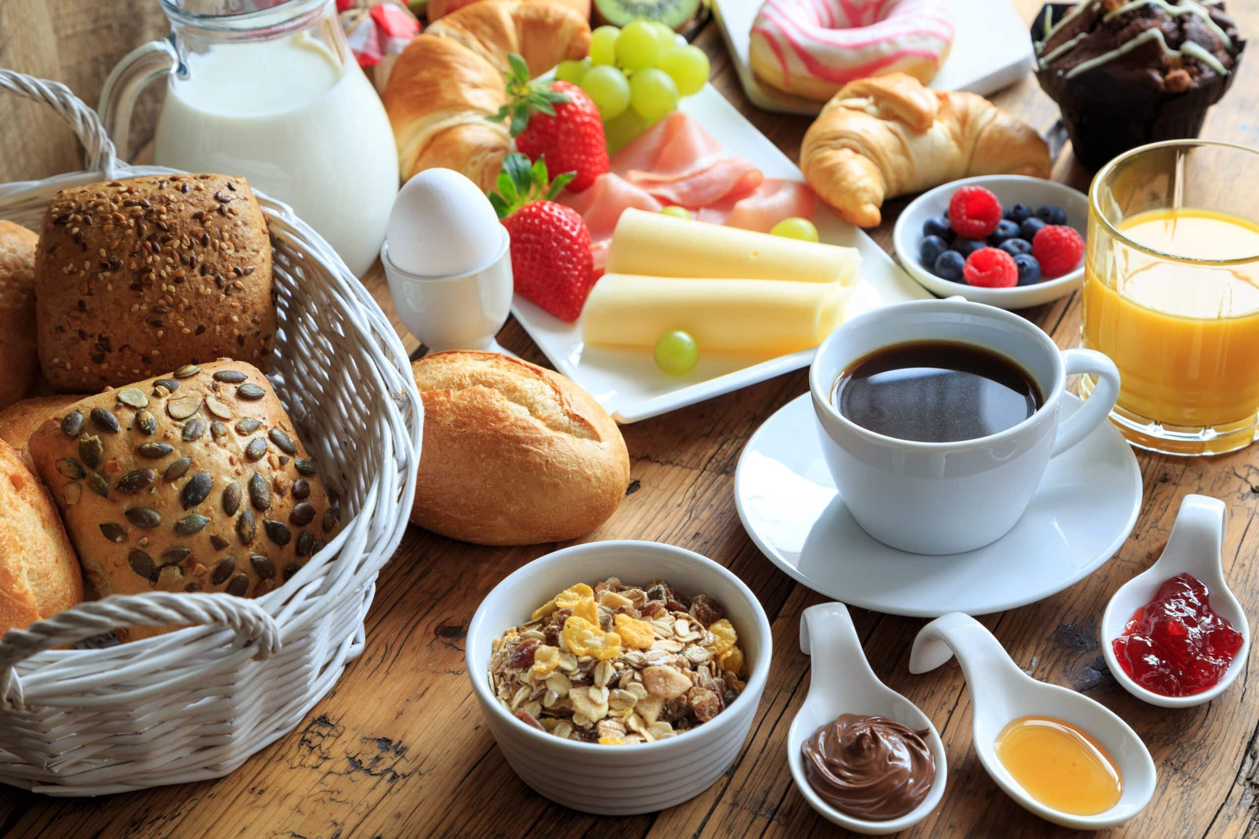 breakfast,table,laid,with,a,variety,of,dishes